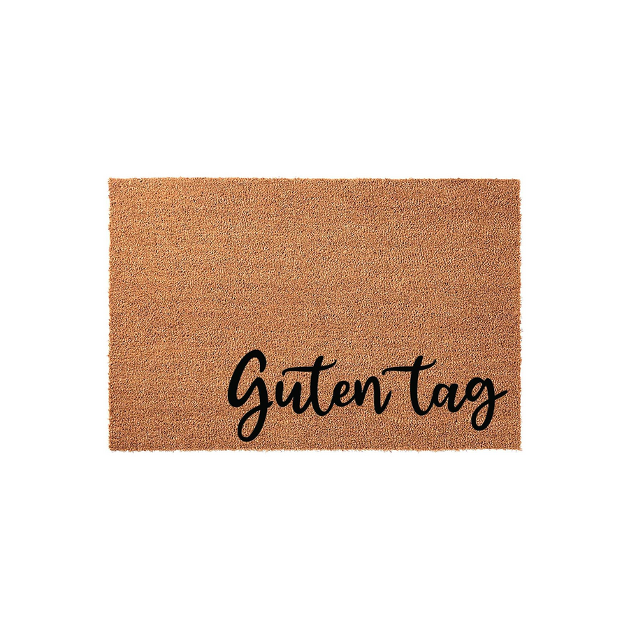 Guten Tag coir doormat featuring a natural brown fiber texture and bold black script lettering, presented on a clean white background to provide a welcoming and stylish entrance for any home or apartment front door entryway.