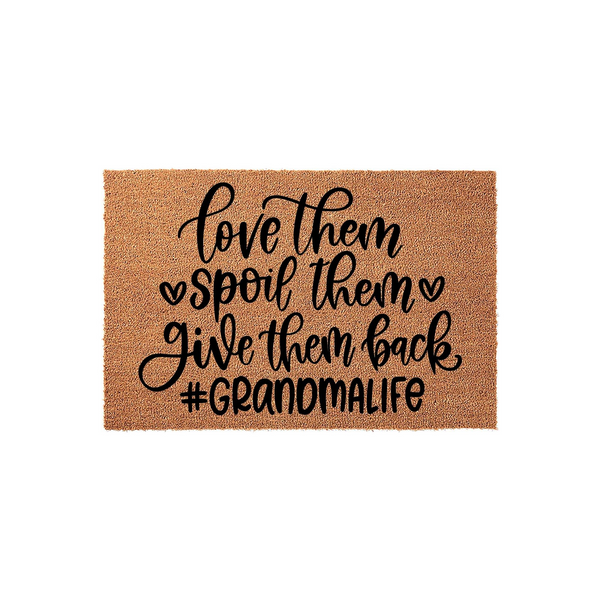Grandma doormat made of natural coir fiber featuring black script text that reads love them spoil them give them back and the hashtag #Grandmalife, displayed against a clean white background for a festive entryway decor look.