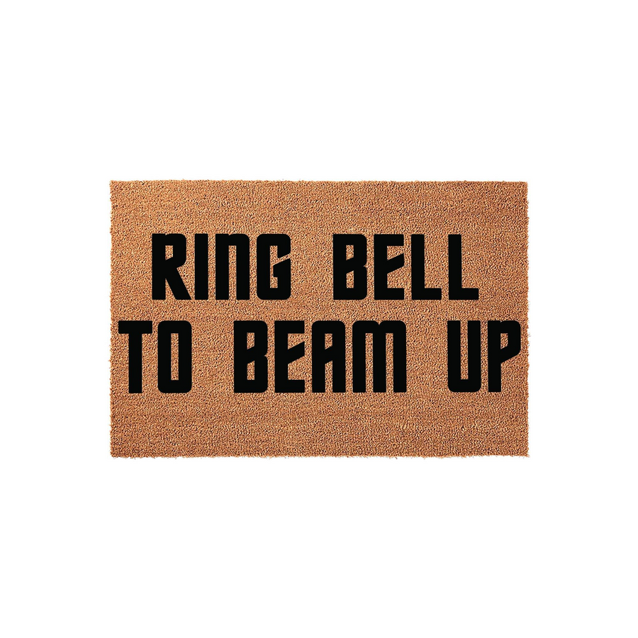 Ring Bell To Beam Up funny doormat featuring bold black text on a natural tan coir fiber background, designed for sci-fi fans who want a humorous welcome mat for their front porch or entryway to greet guests with a space-themed