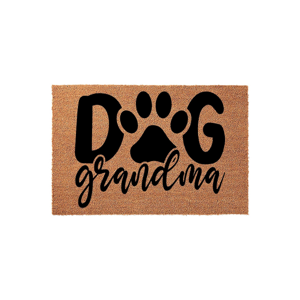 Grandma Dog Lover Coir Doormat featuring a bold black paw print design that replaces the letter O in the word Dog, with the word grandma written in a stylish cursive script on a natural tan textured coir fiber background.
