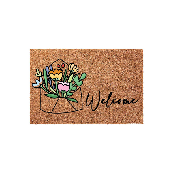 Floral Envelope Welcome Doormat featuring a natural coir texture with a colorful illustration of a bouquet of flowers tucked inside an envelope, accompanied by the word Welcome written in a black cursive script on a plain white