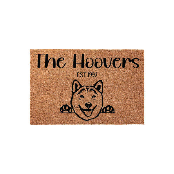 Personalized Shiba Inu dog doormat featuring a cute illustrated dog peeking over the bottom edge, with custom family name text and established year printed in black on a natural tan coir fiber background for a welcoming home