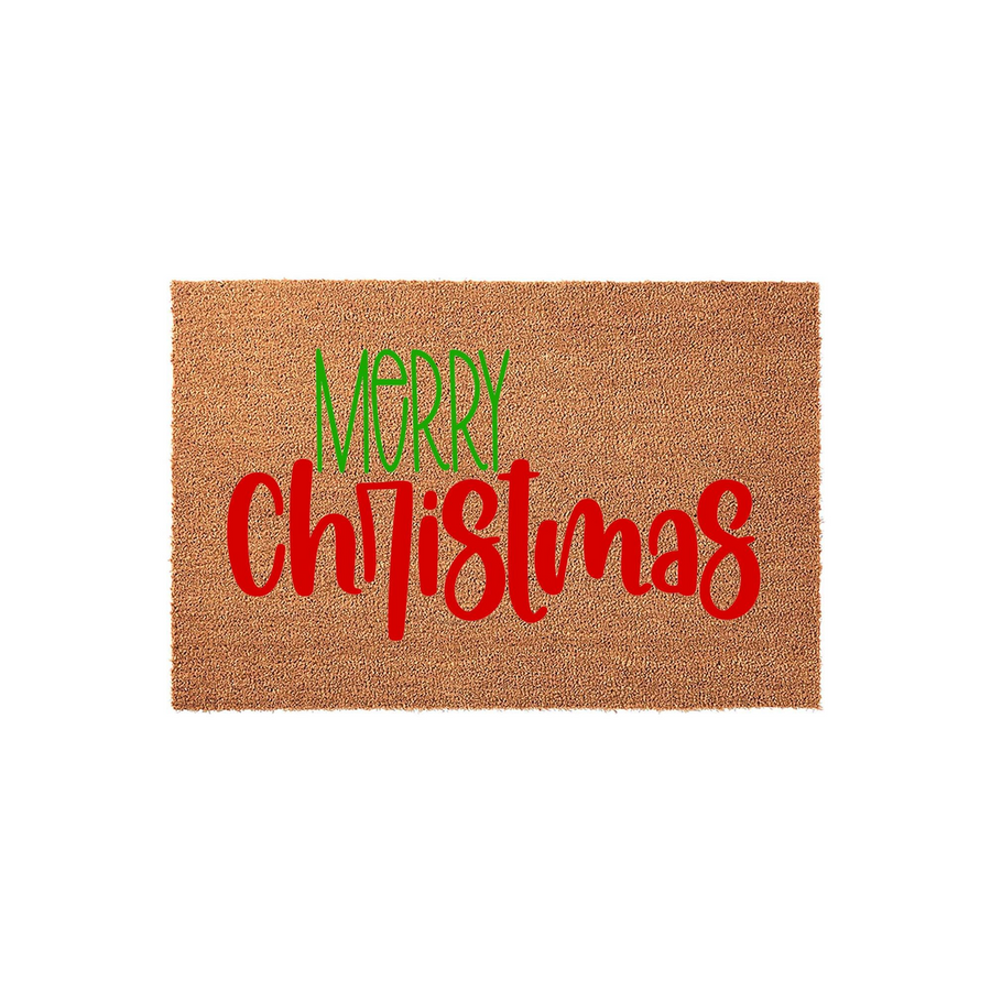Merry Christmas coir doormat featuring a natural brown fiber texture with the word Merry in green and Christmas in red script lettering, providing a festive holiday welcome for your front porch entrance during the winter season.