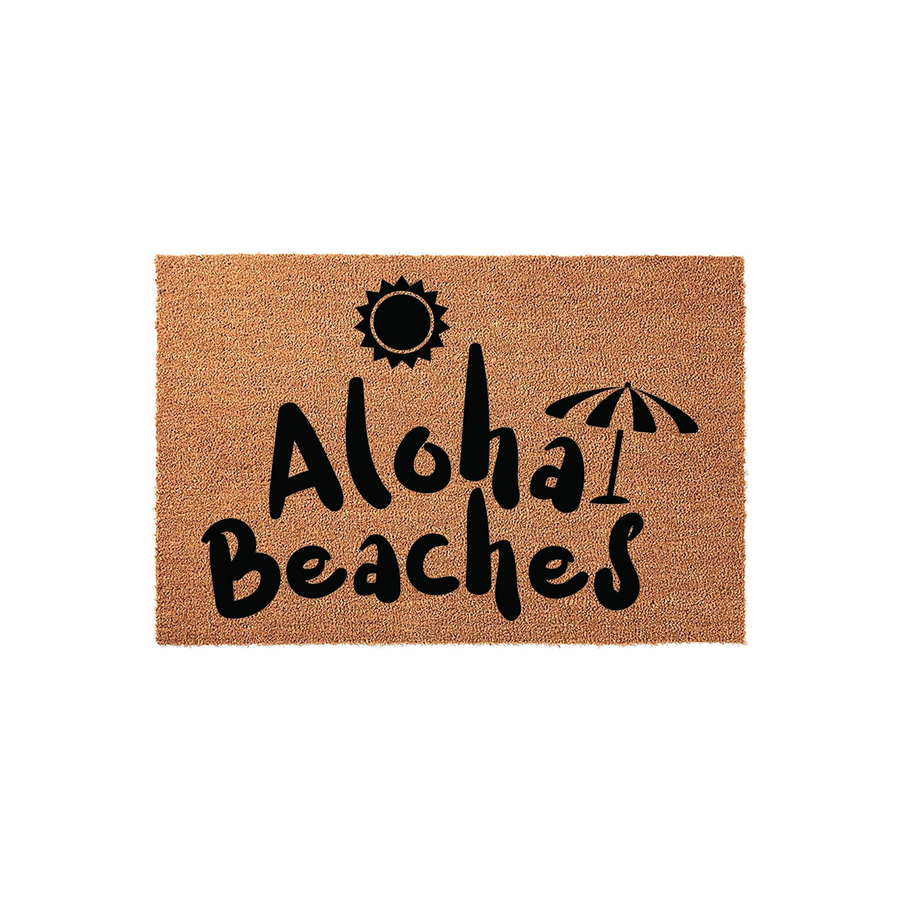 Aloha Beaches coir doormat featuring a natural tan fiber texture with black printed text, a sun icon, and a beach umbrella graphic, making it a fun and tropical welcome mat for your front porch or entryway decor.