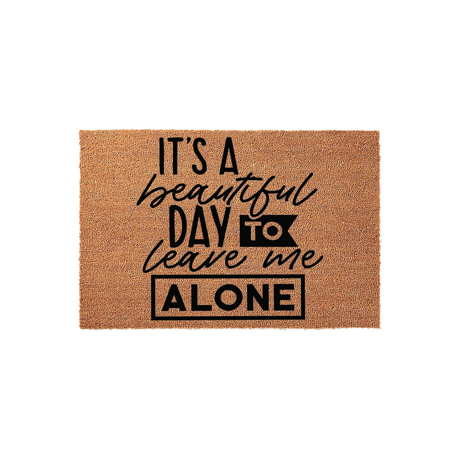 Funny It's a Beautiful Day to Leave Me Alone coir doormat featuring bold black typography on a natural brown coconut fiber background, perfect for adding a humorous and welcoming touch to your front porch or entryway decor.