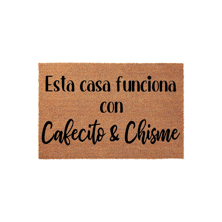Esta casa funciona con Cafecito y Chisme doormat made of natural brown coir fiber, featuring bold black typography centered on the rectangular mat to create a fun and welcoming entrance for any home with a sense of humor.