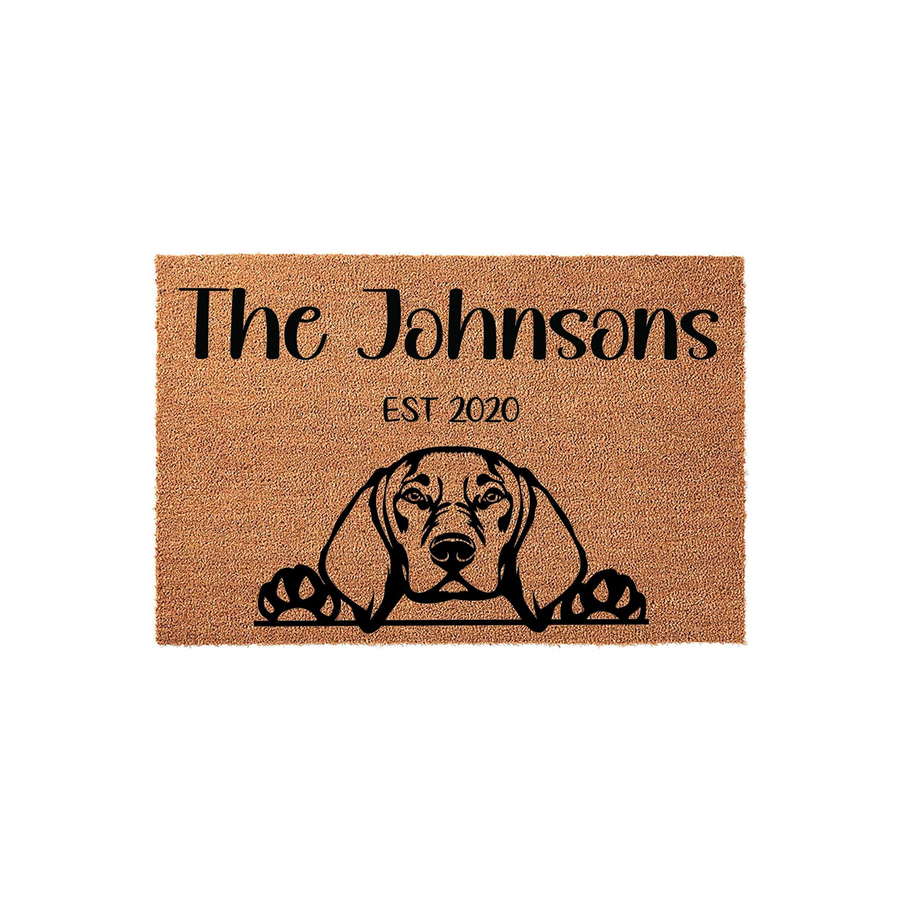 Personalized Beagle dog doormat featuring a cute puppy peeking over the bottom edge, printed on a natural coir fiber mat with a custom family name and established year in elegant black lettering for a welcoming front porch