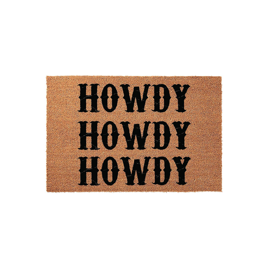 Howdy Western Coir Doormat featuring a natural tan fiber texture with the word Howdy printed three times in a bold black rustic font, creating a welcoming farmhouse style entrance piece for your front porch or home entryway decor.