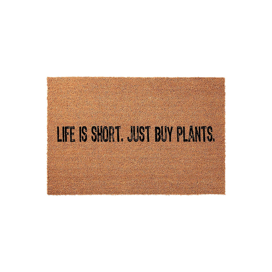 Life is Short Just Buy Plants coir doormat featuring a natural brown fiber texture and bold black lettering, centered on a plain white background to highlight the humorous gardening quote for your front porch entryway decor.