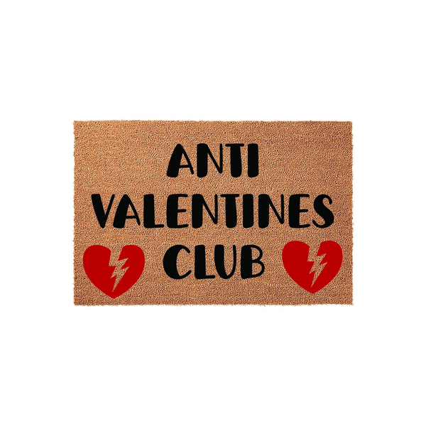 Anti Valentines Club coir doormat featuring bold black text and two red broken heart icons with lightning bolts, set against a natural brown fiber background for a humorous and edgy front porch decor statement piece.
