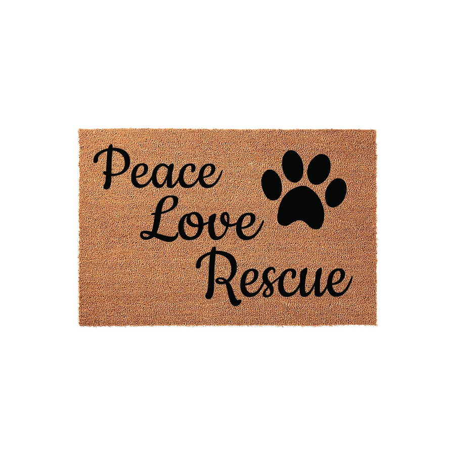 Peace Love Rescue coir doormat featuring a natural brown fiber texture and bold black script lettering, accented by a large paw print icon that celebrates animal adoption and pet lovers in a clean, studio-lit front door entryway