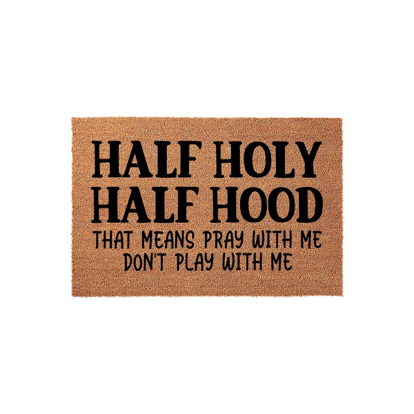 Half Holy Half Hood funny doormat featuring bold black text on a natural coir fiber background, creating a humorous and welcoming entrance piece for your front porch that clearly displays the witty quote for all your house guests