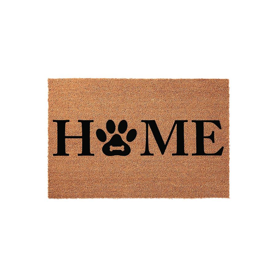 Dog Paw Print Home Coir Doormat featuring a natural tan fiber texture with bold black lettering that replaces the letter O with a cute paw print design, creating a welcoming entrance for any pet lover's front porch or entryway