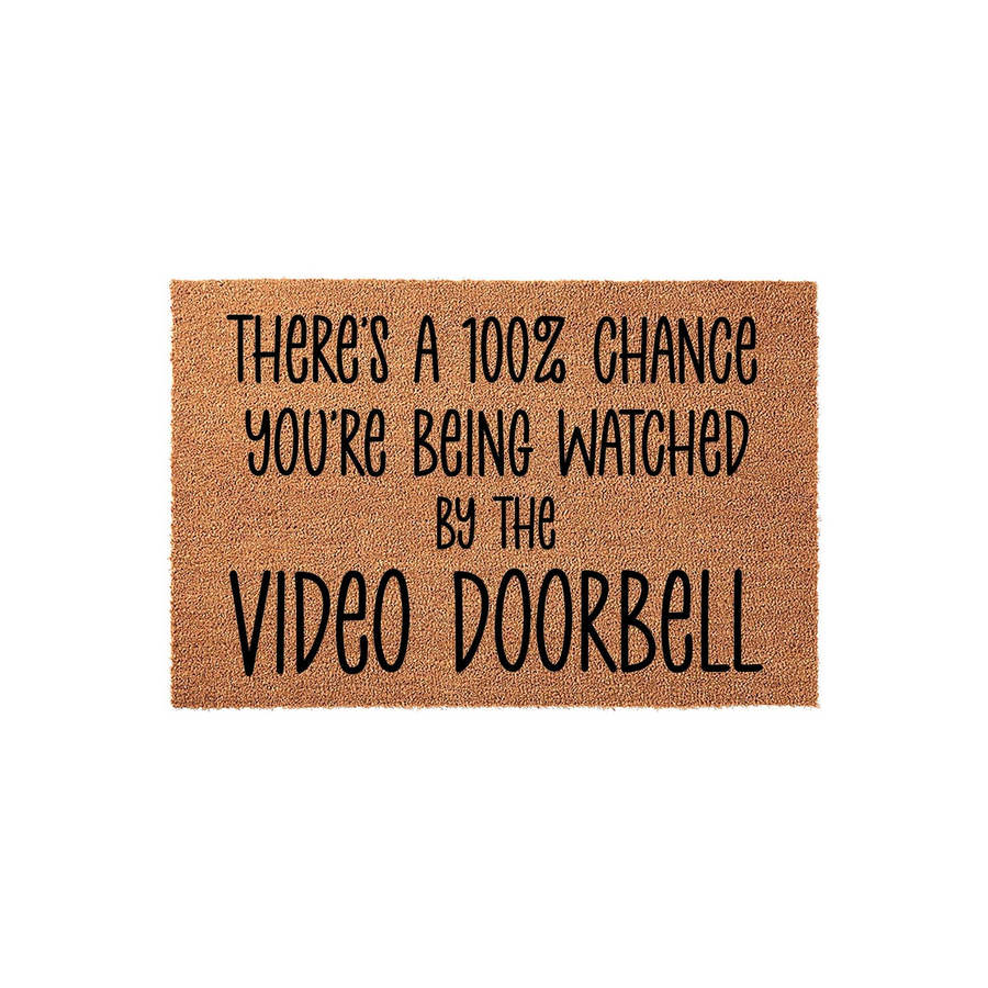 Funny Video Doorbell Coir Doormat featuring the text There is a 100 percent chance you are being watched by the video doorbell in bold black lettering, set against a natural brown textured fiber background for a modern front