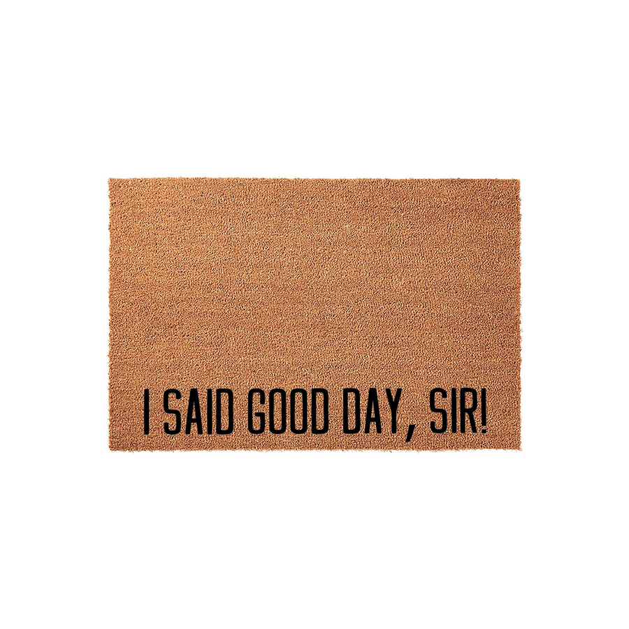 I Said Good Day, Sir! funny doormat made of natural coir fiber with a textured brown surface, featuring bold black lettering that adds a humorous and welcoming touch to any front porch or entryway decor for movie fans.