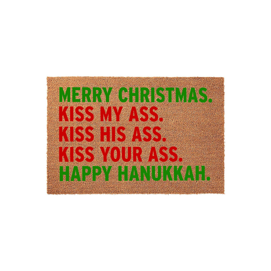 Funny Christmas and Hanukkah doormat made of natural coir fiber, featuring bold red and green text that reads Merry Christmas, Kiss My Ass, Kiss His Ass, Kiss Your Ass, Happy Hanukkah against a plain white studio background.