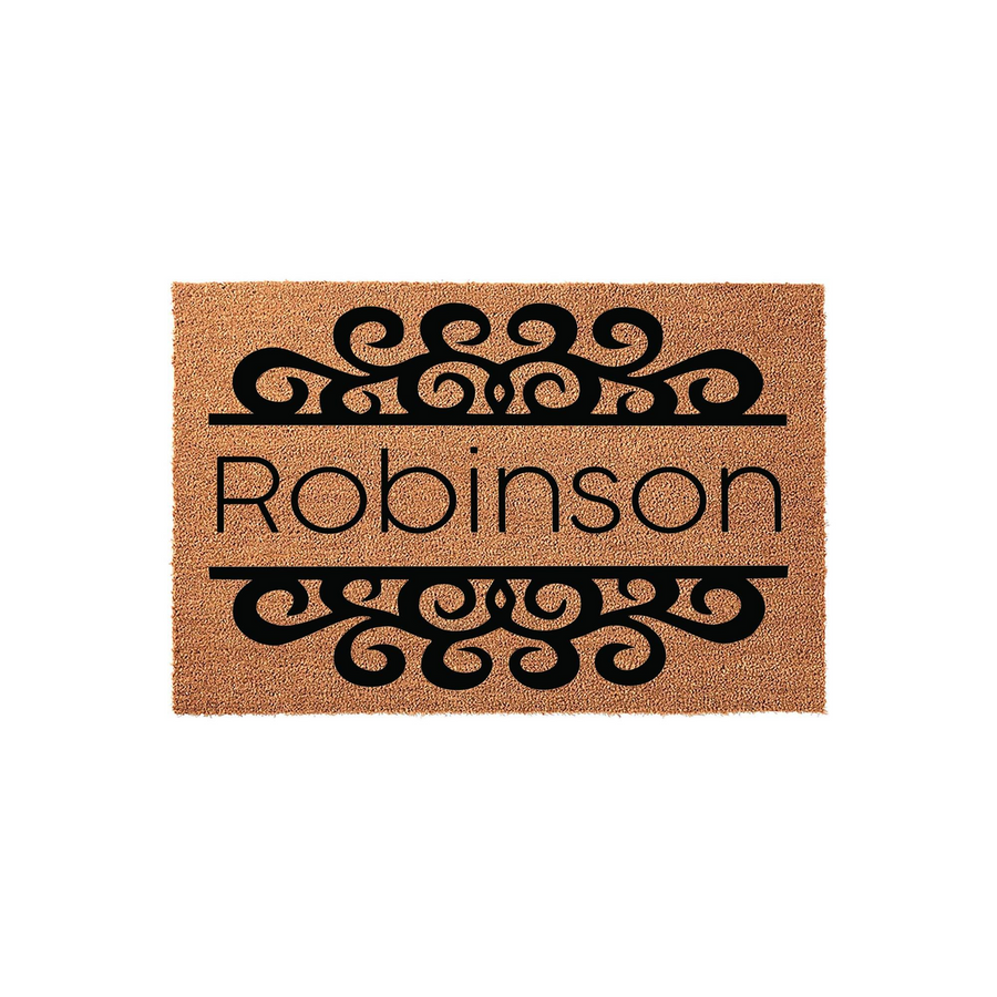 Personalized family name coir doormat featuring a classic black scrollwork design above and below the custom text, set against a natural tan textured fiber background for a welcoming front porch entrance that highlights your home