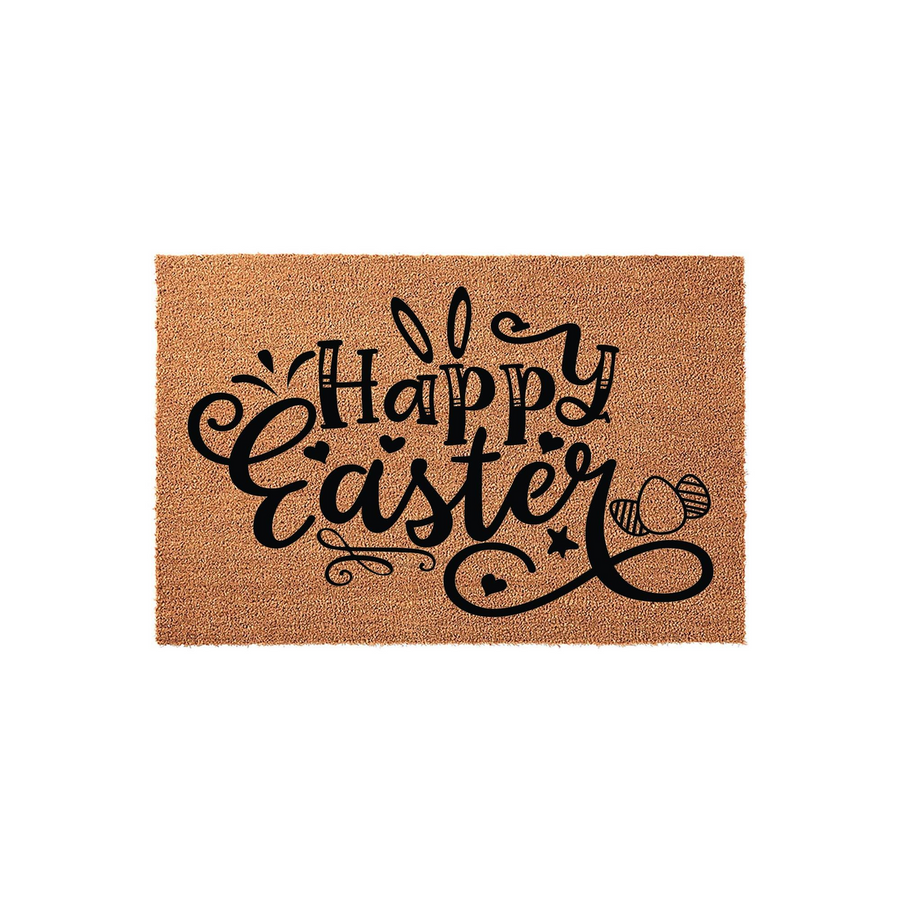 Happy Easter coir doormat featuring a natural brown fiber texture with black printed text, decorative bunny ears, and small heart accents, creating a festive spring entryway decor piece for your front porch or home entrance.