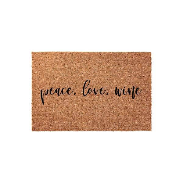 Peace Love Wine coir doormat featuring a natural brown fiber texture and elegant black script lettering centered on the mat, providing a fun and welcoming entrance decor piece for any home entryway or front porch area.
