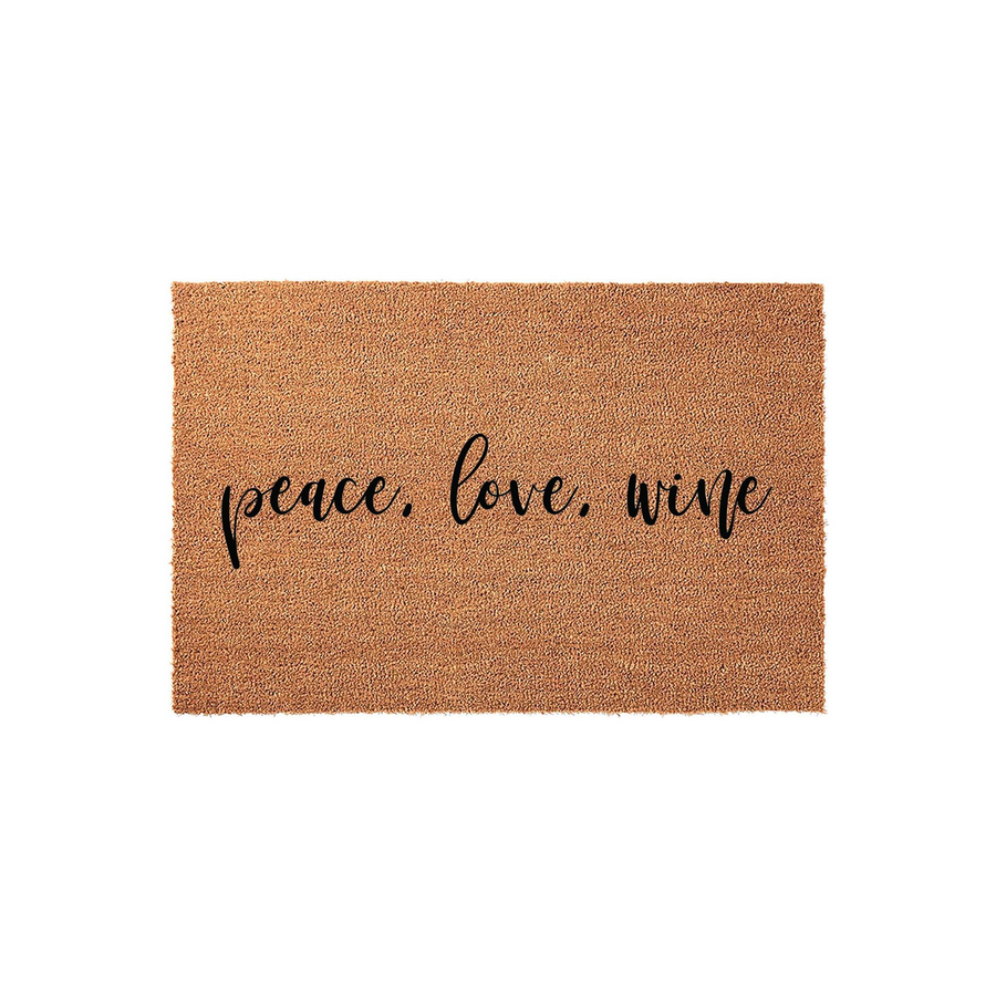 Peace Love Wine coir doormat featuring a natural brown fiber texture and elegant black script lettering centered on the mat, providing a fun and welcoming entrance decor piece for any home entryway or front porch area.