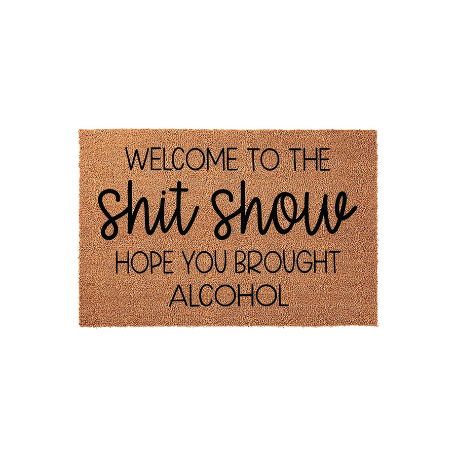 Funny Welcome To The Shit Show Hope You Brought Alcohol doormat featuring bold black typography printed on a natural tan coir fiber mat, creating a humorous and inviting entryway decor piece for your home front porch or apartment