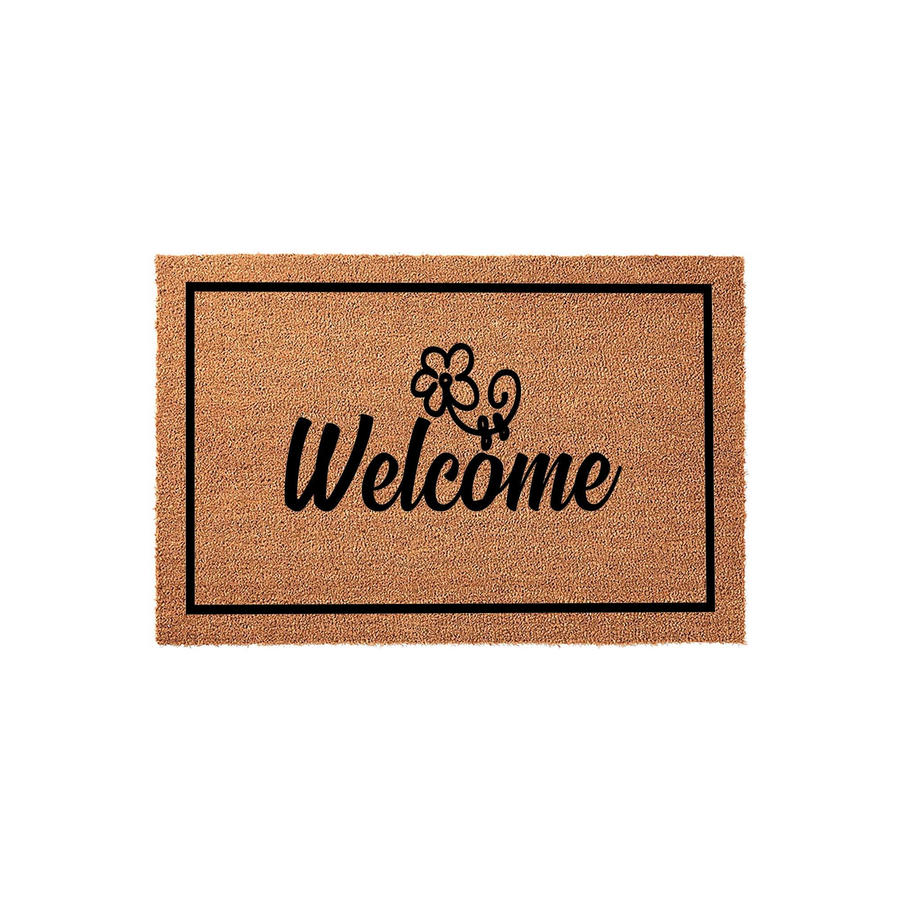 Floral Welcome Coir Doormat featuring a natural brown fiber texture with a black rectangular border, elegant script lettering, and a simple flower icon centered on a clean white background for a modern farmhouse entryway decor