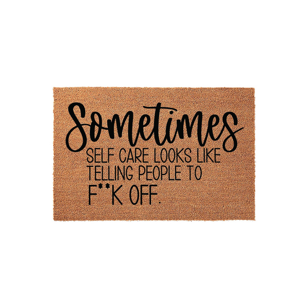 Funny Sarcastic Doormat featuring a natural coir texture with bold black lettering that reads Sometimes Self Care Looks Like Telling People To F**k Off, making it a humorous and cheeky addition to any front porch or entryway