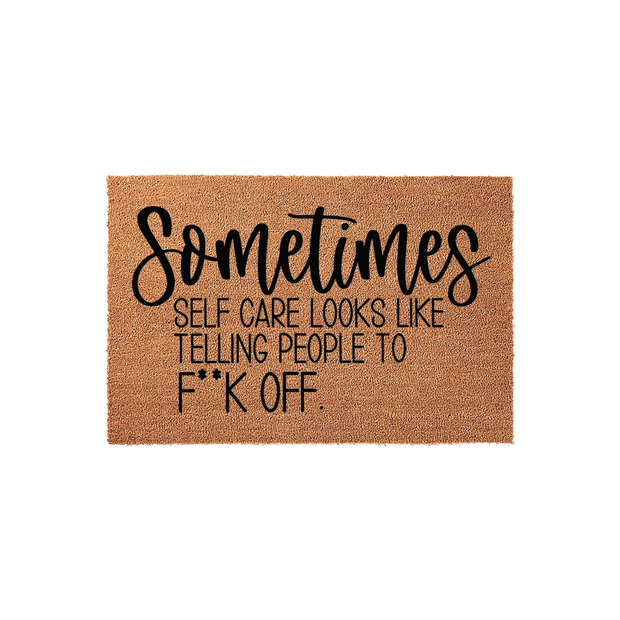 Funny Sarcastic Doormat featuring a natural coir texture with bold black lettering that reads Sometimes Self Care Looks Like Telling People To F**k Off, making it a humorous and cheeky addition to any front porch or entryway