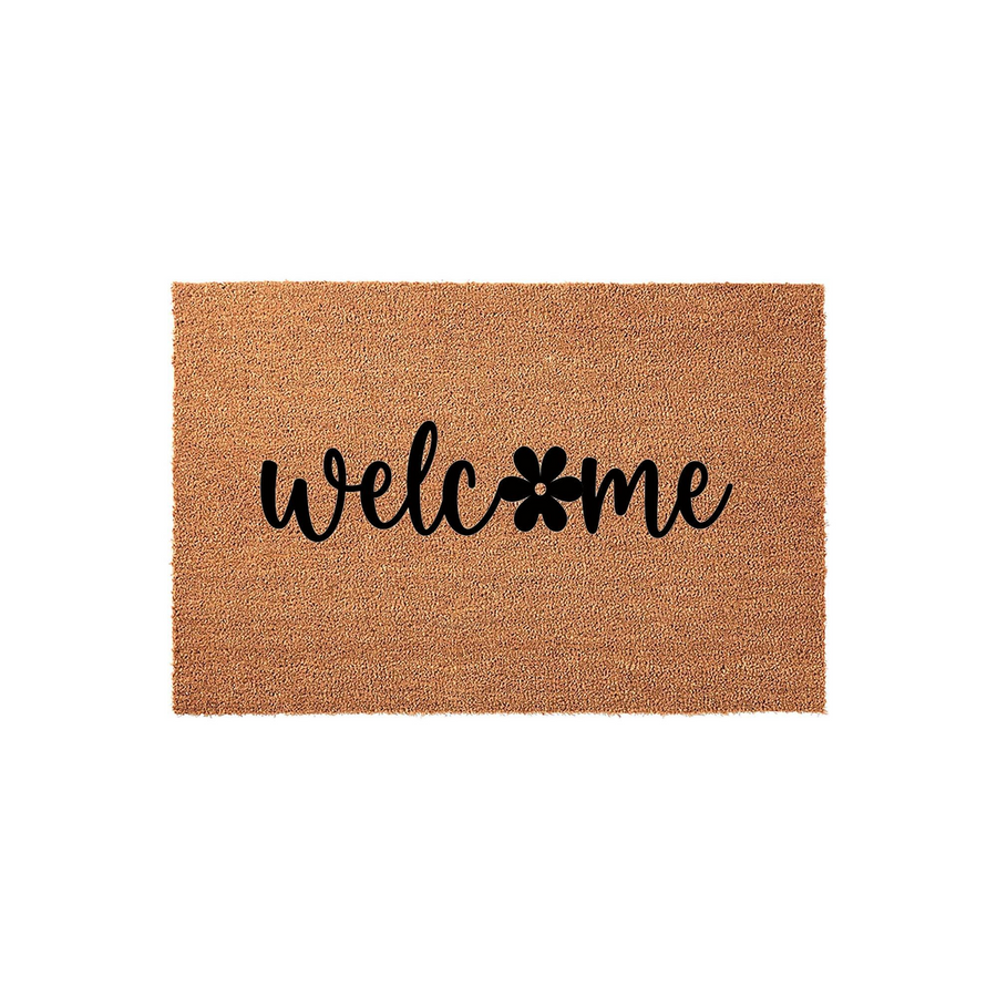 Floral Welcome Doormat featuring a natural coir fiber texture with the word welcome printed in black script, where the letter o is replaced by a simple black flower icon on a clean white studio background for a modern entryway.