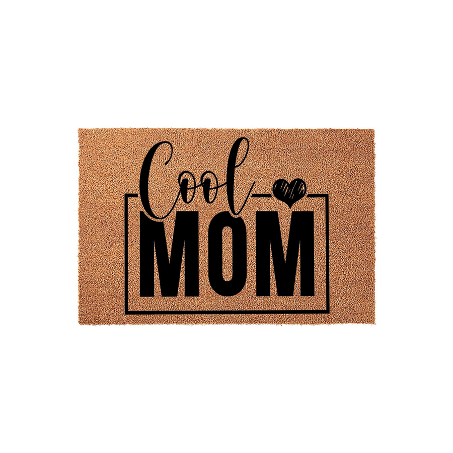 Cool Mom natural coir doormat featuring a bold black design with the text Cool Mom and a small heart icon, set against a plain white background to highlight the textured brown fiber material of this front porch welcome mat.