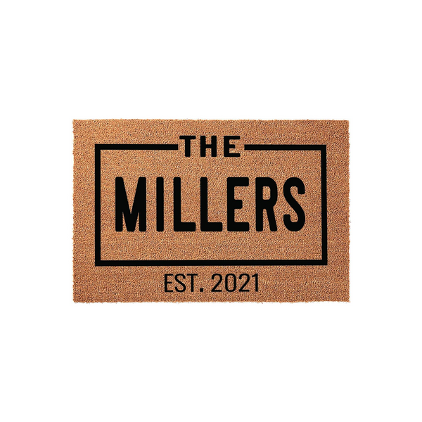 Personalized family name coir doormat featuring a clean, modern black rectangular border design with the text The Millers and an established year, set against a natural tan textured coconut fiber background for a welcoming home