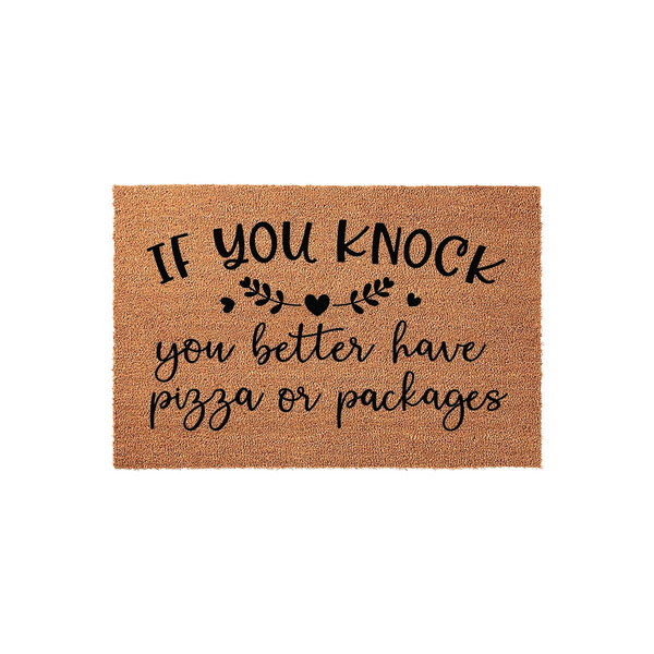 Funny Coir Doormat with the text If You Knock You Better Have Pizza Or Packages printed in black ink, featuring decorative leaves and a heart icon on a natural brown textured fiber background for a humorous front porch welcome.