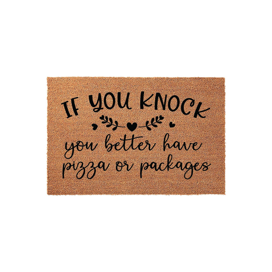 Funny Coir Doormat with the text If You Knock You Better Have Pizza Or Packages printed in black ink, featuring decorative leaves and a heart icon on a natural brown textured fiber background for a humorous front porch welcome.