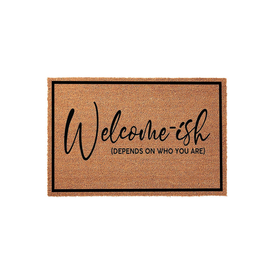 Funny Welcome-ish Doormat featuring a natural coir texture with a black border and bold, playful typography that reads Welcome-ish, depends on who you are, making it a humorous front porch decor piece for any modern home entrance.