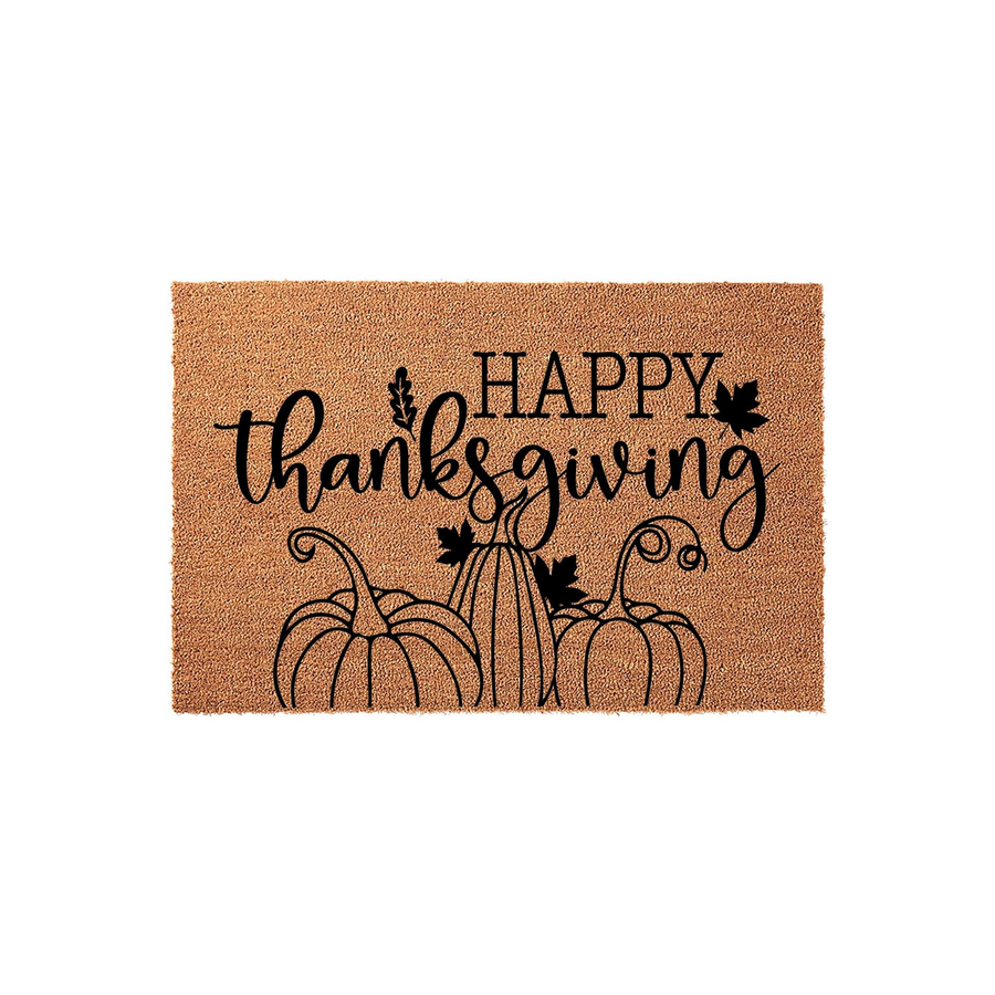 Happy Thanksgiving coir doormat featuring a natural brown fiber texture with black printed text and a charming illustration of three pumpkins with autumn leaves, creating a festive seasonal welcome for your front porch entryway.