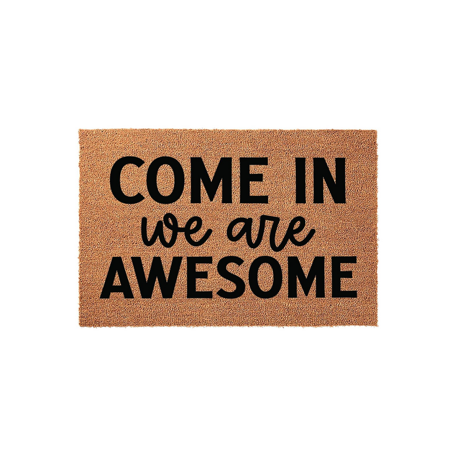 Come In We Are Awesome Doormat featuring a natural coir fiber texture with bold black lettering that reads Come In we are AWESOME, creating a fun and welcoming entrance for your front porch or home entryway on a plain white