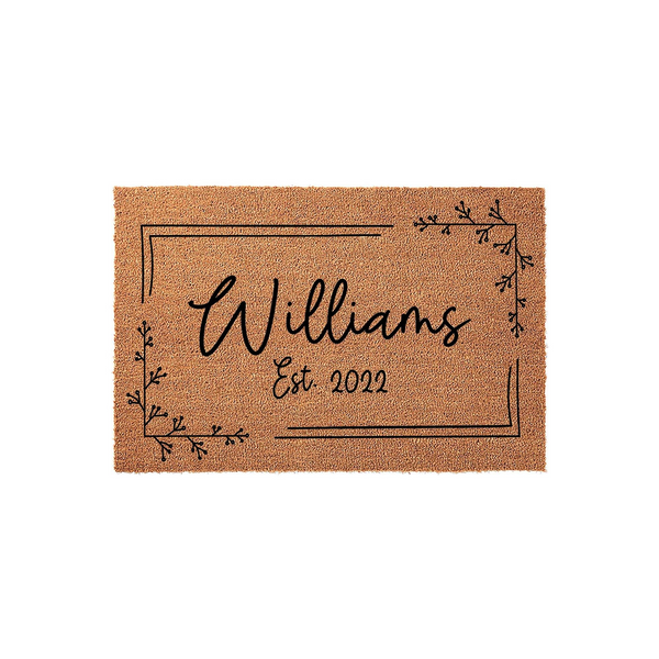 Personalized family name coir doormat featuring a minimalist black line border and delicate botanical corner accents, displaying a custom last name and established year on a natural brown textured fiber background for a modern