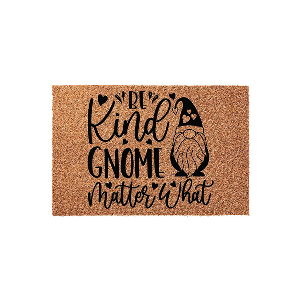 Be Kind Gnome Matter What doormat featuring a cute bearded gnome illustration and black text printed on a natural tan coir fiber background, creating a welcoming and whimsical entryway decor piece for your home or front porch.