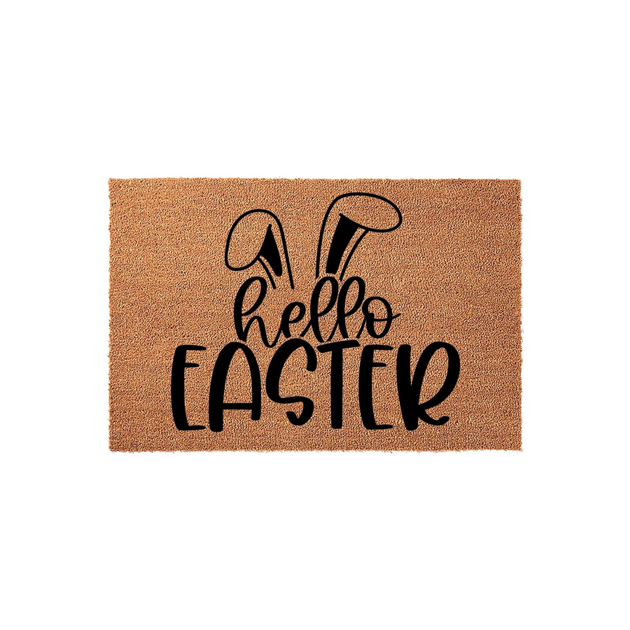 Hello Easter coir doormat featuring a natural brown fiber texture and black printed text with cute bunny ears, creating a festive spring entryway decor piece that welcomes guests to your home during the holiday season.