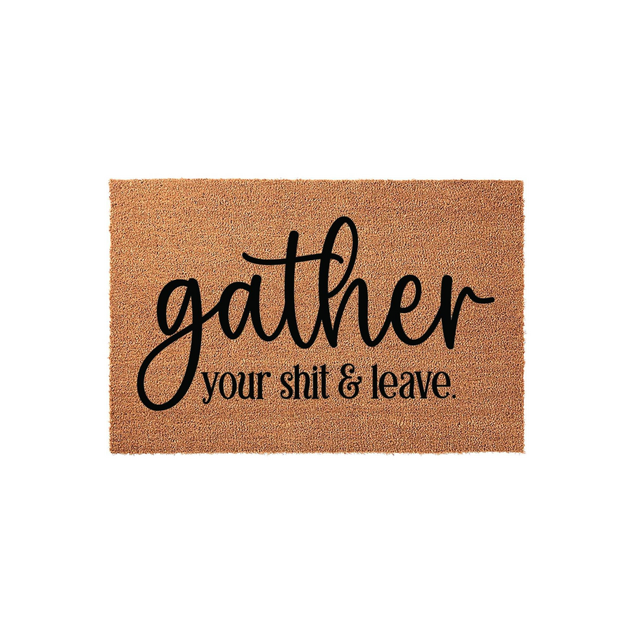 Funny Gather Your Shit and Leave doormat featuring bold black typography printed on a natural brown coir fiber mat, creating a humorous and sarcastic welcome sign for your front porch or entryway decor in a clean studio setting.