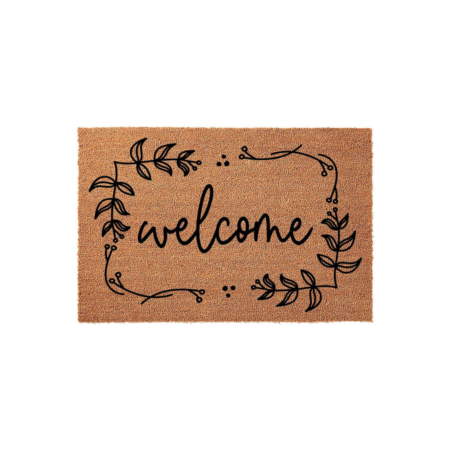 Floral Welcome Coir Doormat featuring a natural tan fiber texture and a black printed design of a delicate leafy vine border surrounding the word welcome in a modern script font, set against a clean and simple white studio