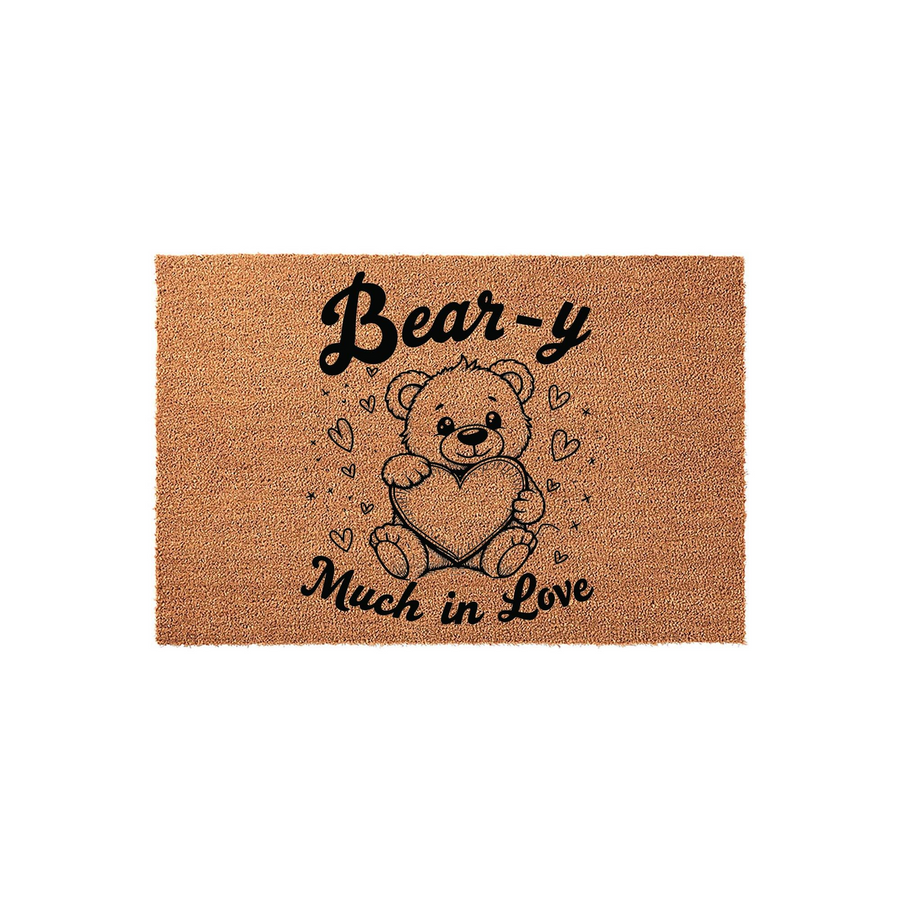 Bear-y Much in Love coir doormat featuring a cute illustrated teddy bear holding a large heart, surrounded by small heart and star accents, set against a natural brown textured fiber background for a charming entryway decor piece.