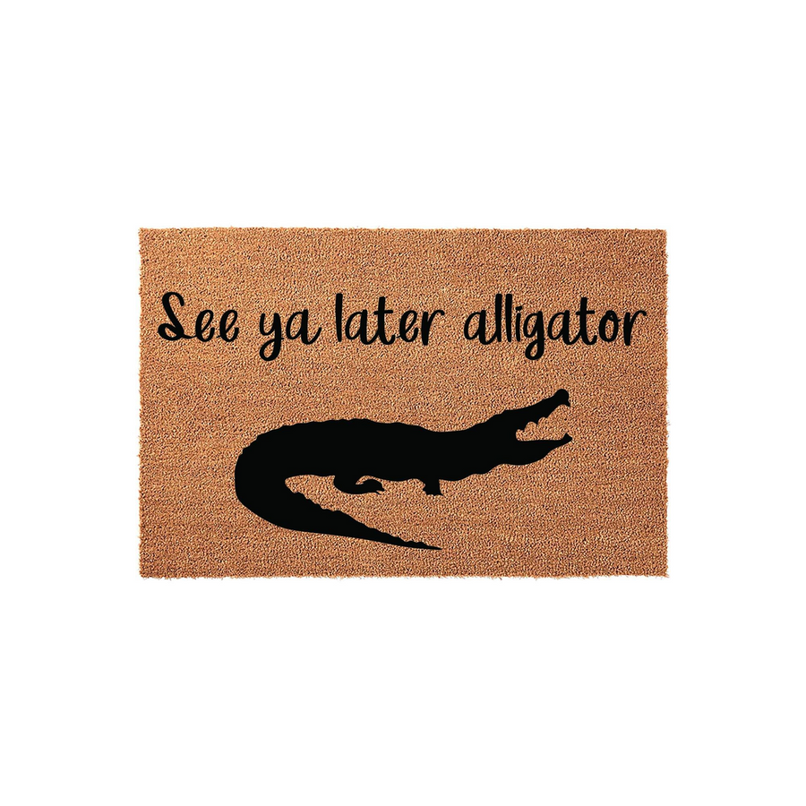 See ya later alligator coir doormat featuring a natural brown fiber texture and a bold black silhouette of an alligator, perfect for adding a fun and welcoming touch to your front porch or entryway decor for guests to enjoy.