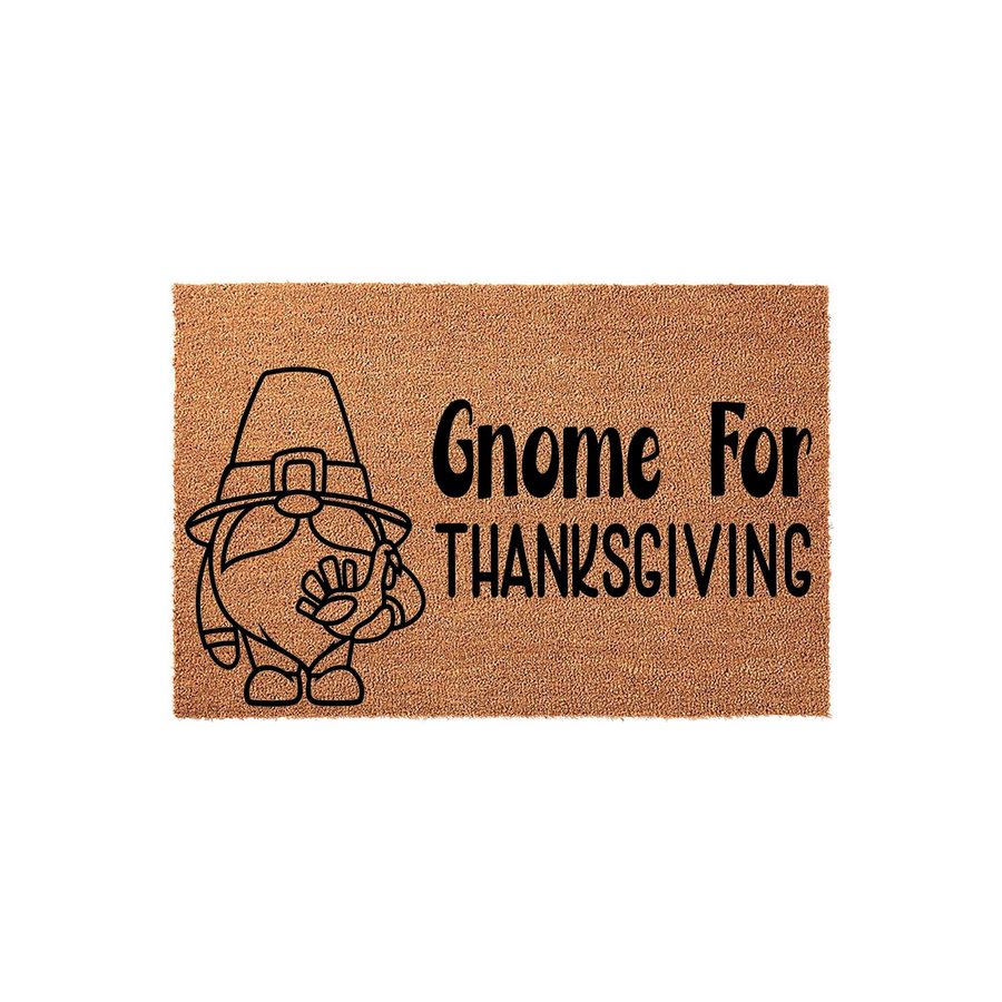 Gnome For Thanksgiving coir doormat featuring a cute illustrated gnome wearing a pilgrim hat, printed in bold black ink on a natural brown textured fiber background to welcome guests for the fall holiday season.
