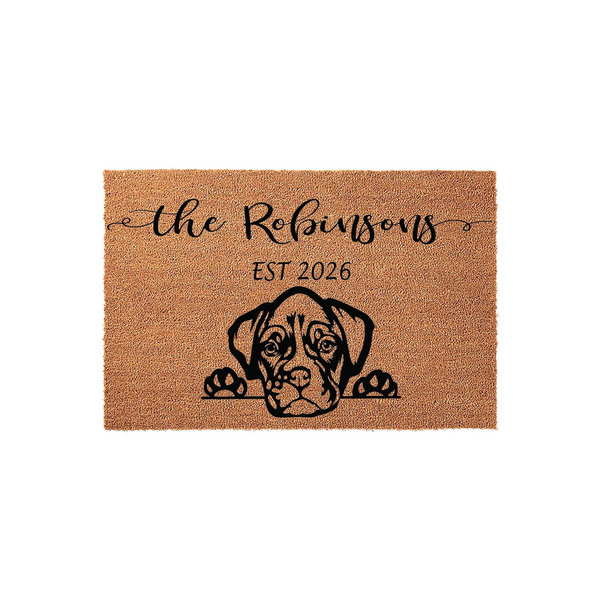 Personalized Boxer dog doormat featuring a cute black illustration of a Boxer peeking over the edge, customized with a family name and established year on a natural tan coir fiber background for a welcoming front porch entrance.