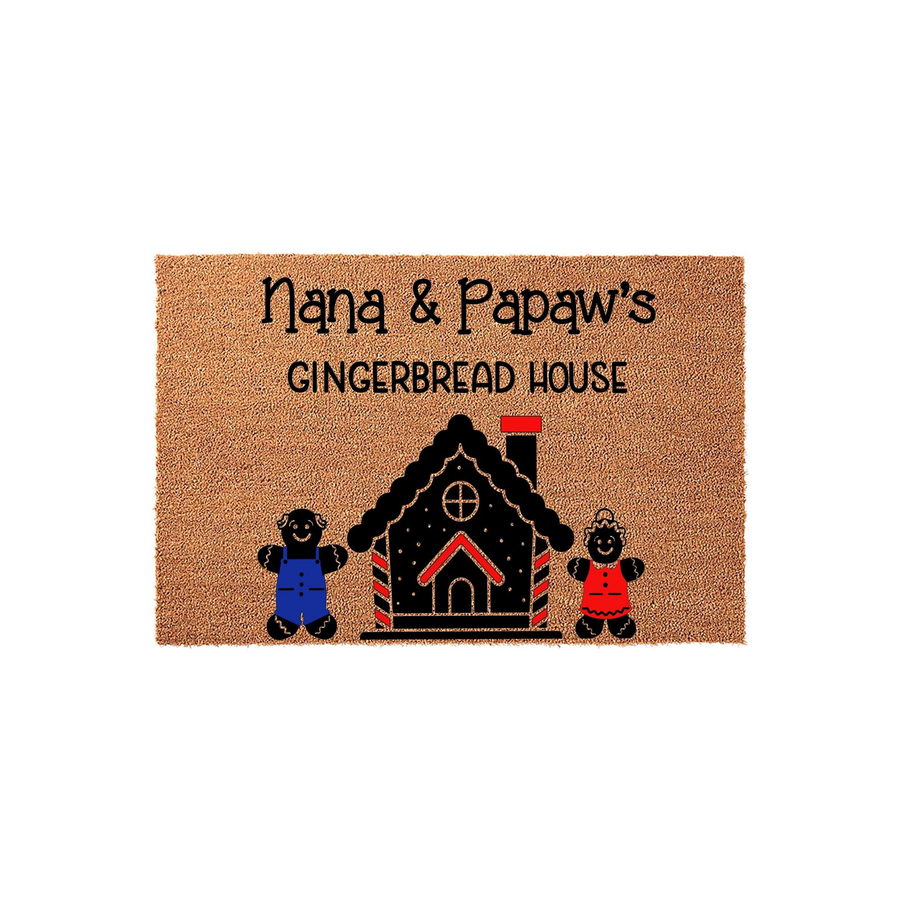 Nana and Papaw's Gingerbread House personalized coir doormat featuring a festive holiday design with two gingerbread characters standing in front of a decorated house on a natural brown textured fiber background for a cozy home