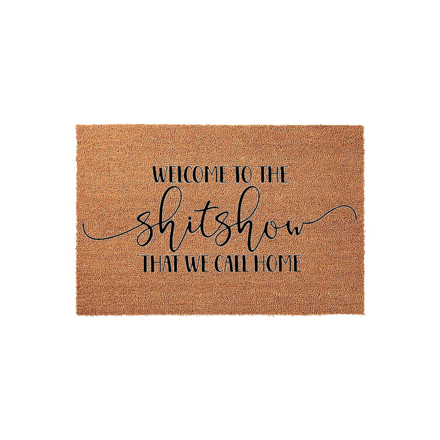 Funny Welcome to the Shitshow Coir Doormat featuring bold black typography on a natural brown fiber background, designed to add a humorous and welcoming touch to your front porch entryway decor for guests arriving at your home.