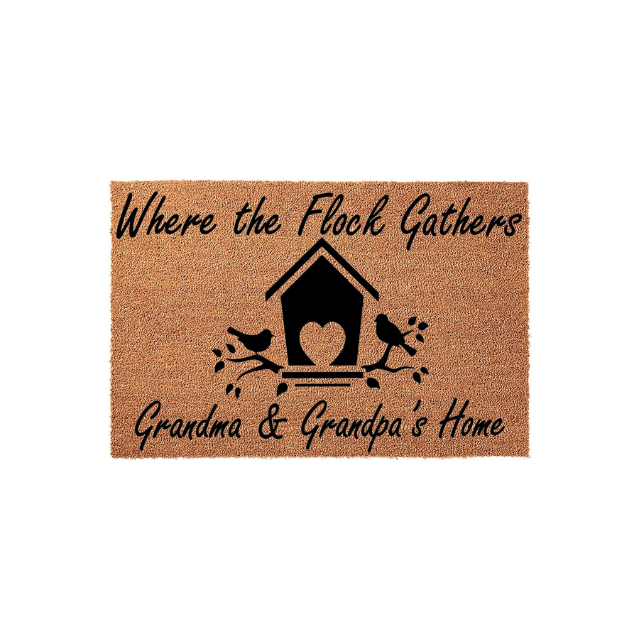 Grandma and Grandpa coir doormat featuring a birdhouse and bird design with the text Where the Flock Gathers, providing a warm welcome for guests at the front door of a home with a natural tan fiber texture and black printed