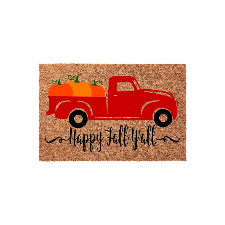 Happy Fall Y'all coir doormat featuring a vibrant red vintage truck carrying bright orange pumpkins, set against a natural tan textured background to provide a festive seasonal welcome for your front porch entryway decor.