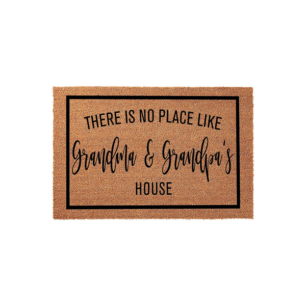 Grandma and Grandpa's house doormat featuring a natural coir texture and a black rectangular border, printed with the text There Is No Place Like Grandma and Grandpa's House in a mix of bold and elegant script fonts.